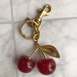 Coach Gold-Tone Hardware with Red Glitter Cherry Key Charm